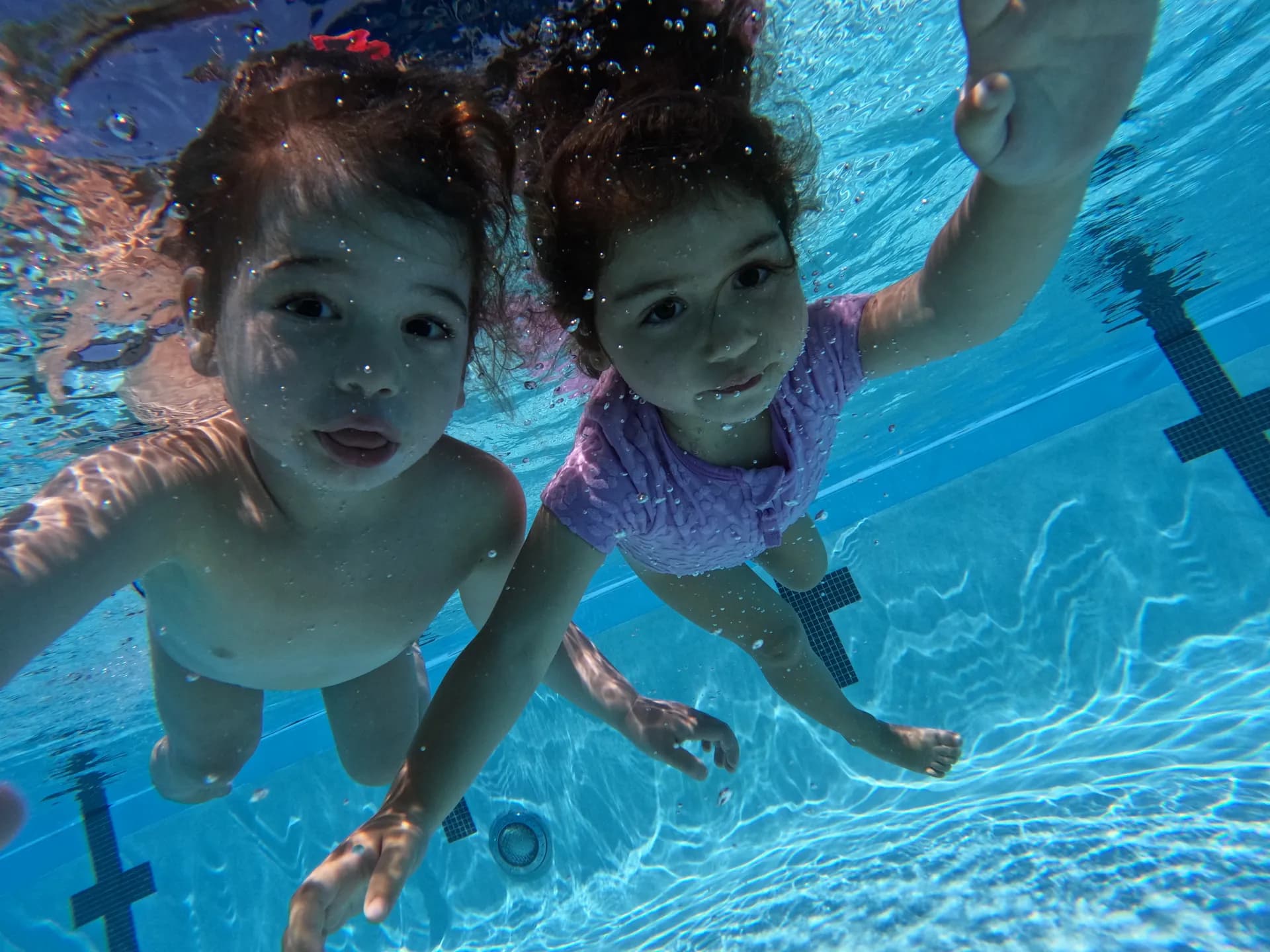Happy kids taking a selfie after swim class