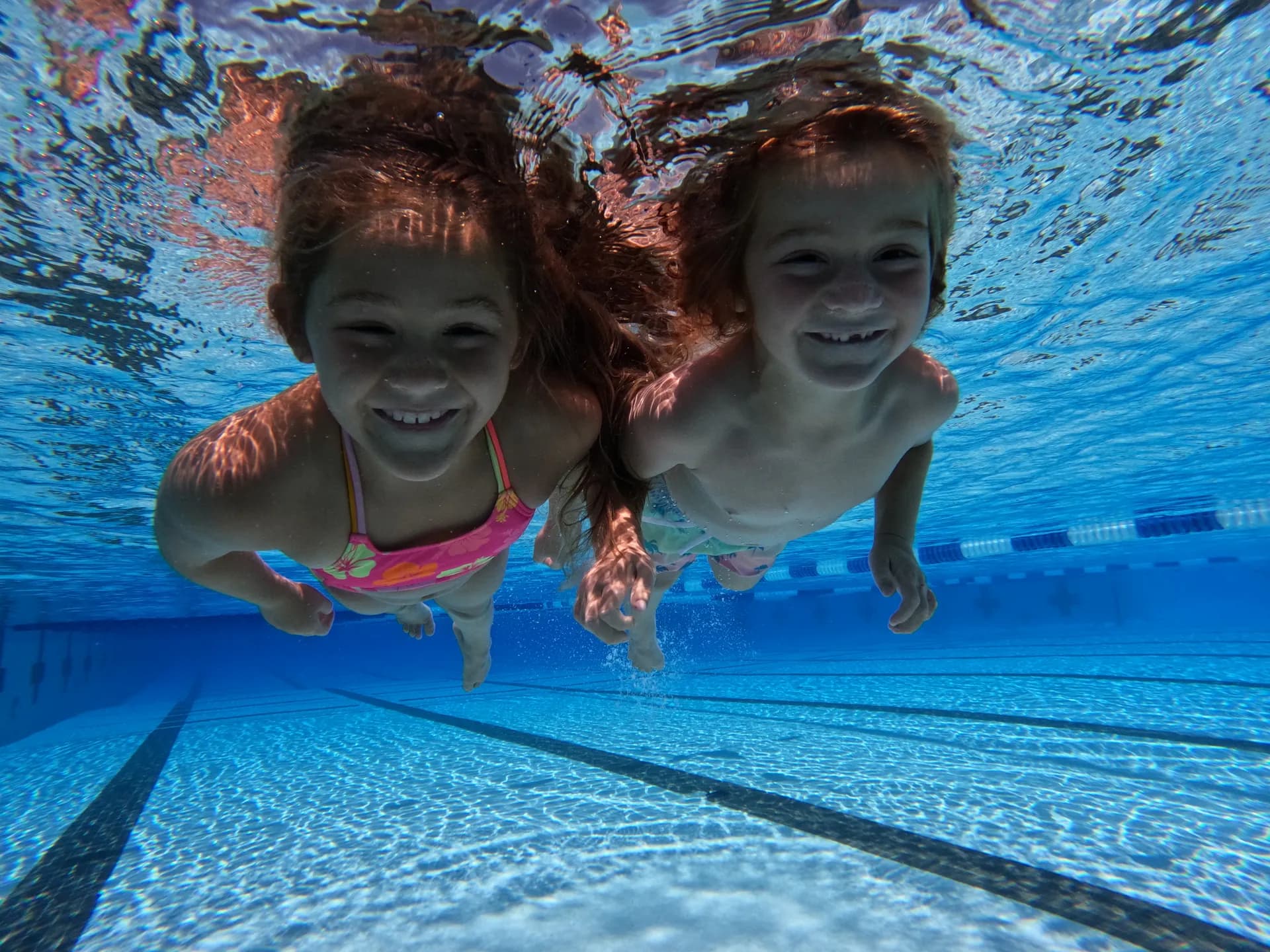 Two children smiling together after lessons