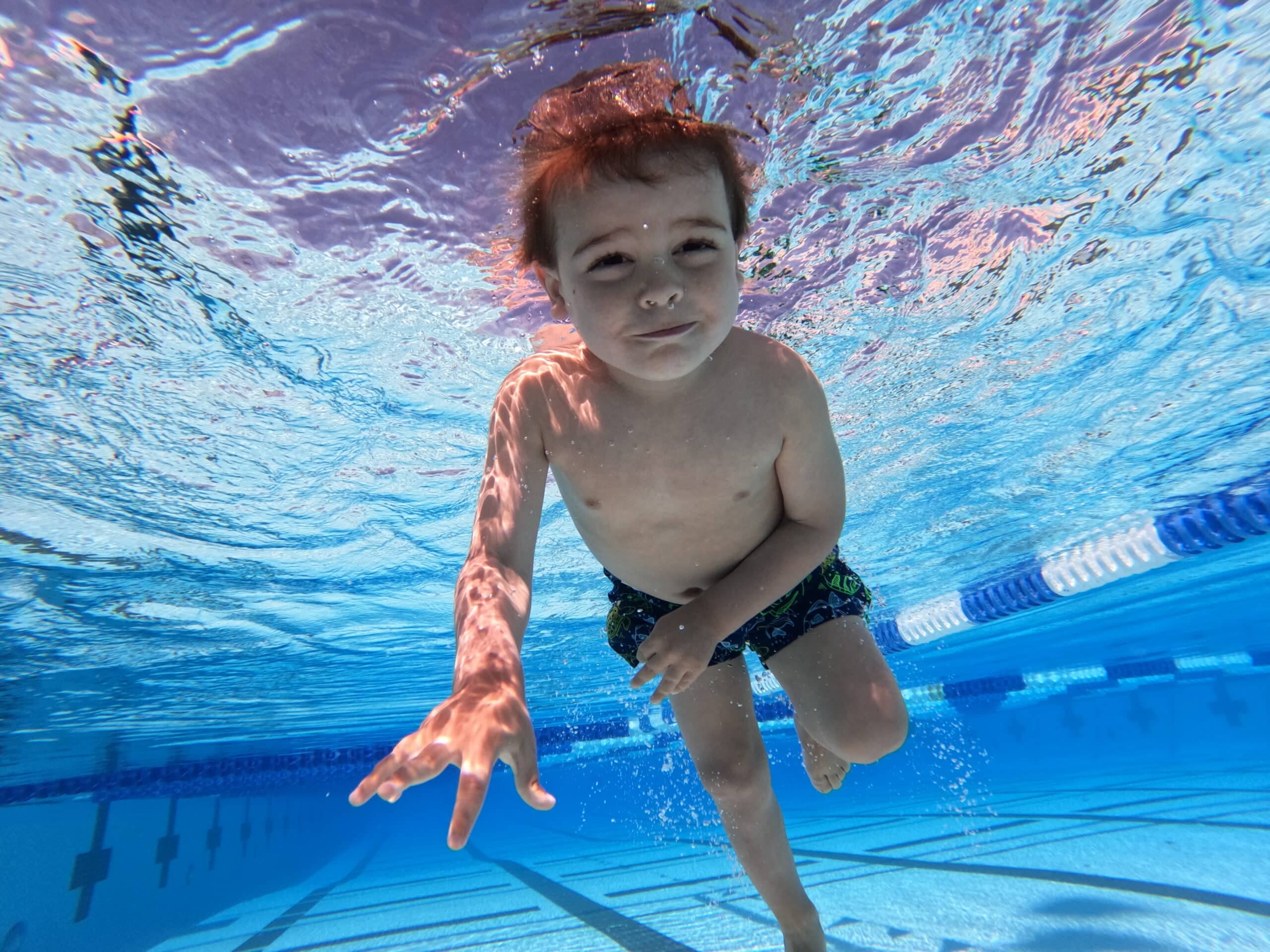 Child demonstrating ISR swim skills